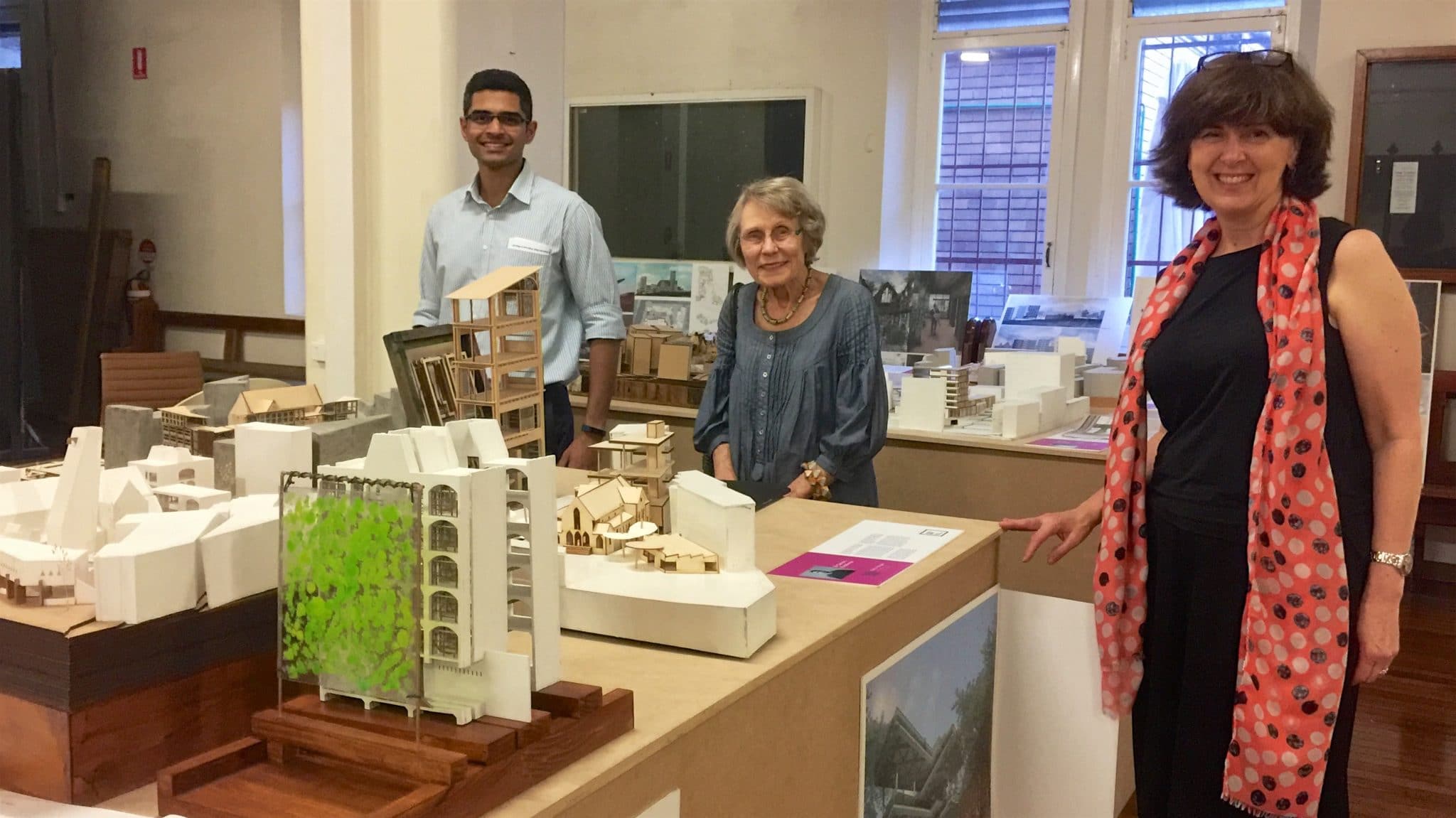 Dwayne and Anne inspecting the exhibits in the Church hall with parish councillor Sue
